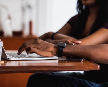 People in tech at a laptop