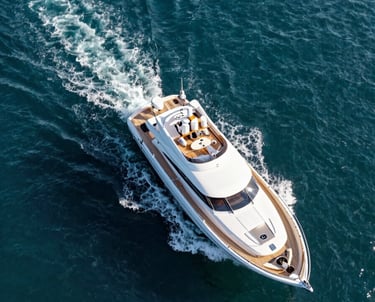 High-angle drone shot of a luxury yacht sailing through turquoise waters near Bodrum coastline. Clean, sharp photography style. Turkish / Aegean Coast.