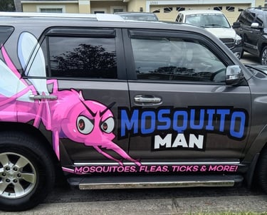 Trained mosquito control technician applying barrier treatment