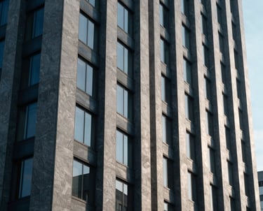 Photography of a high-tech modern building facade in a Latin American business district. Slate gray blue and Oxford navy tones.