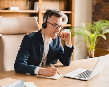 a business person receiving coaching on a video call