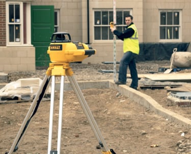 Professional laser level setup to ensure precise grading and proper water drainage on-site