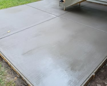 Broom-finish concrete detail with control joints.