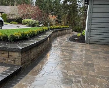 Luxury hardscape design in North York featuring stone retaining walls and interlock patios.