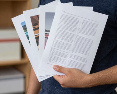 A team collaborating over laptops and digital charts in a bright modern office.