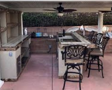 a kitchen with a bar stool and a bar stool