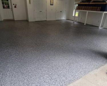 a garage flooring with a garage flooring and a garage door
