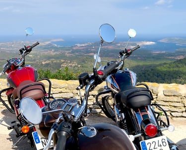 Motorcycle tour at a scenic viewpoint overlooking the coast of Menorca