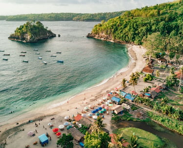 Aerial view of Crystal Bay beach in Nusa Penida Bali with white sand and turquoise water.