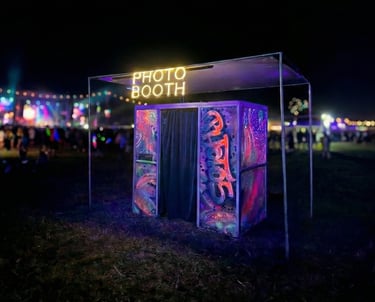 a photo booth with cool paint at an outdoor music festival