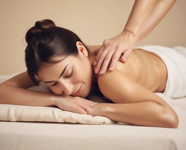 A serene massage room with soft lighting and a massage table prepared for a deep tissue session.