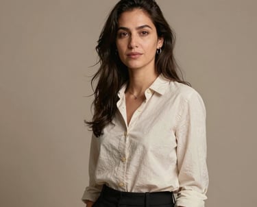 Professional portrait of a female creative technologist in a modern Lisbon studio. Warm taupe background, minimalist style, professional attire.