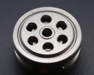A close-up of a custom mechanical part designed to solve a complex problem.