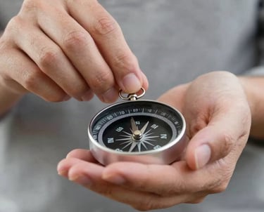 A close-up shot of hands carefully handling a compass or a set of keys, representing stewardship and responsibility. Soft, natural lighting highlights the textures of #A2B2AE and #1A1A1A.