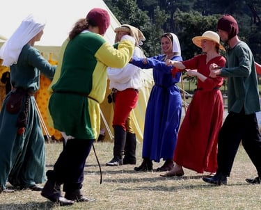 Lords and Ladies enjoy medieval dancing to medieval music