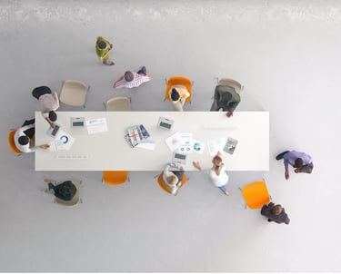 Ceiling view of conference table and employees