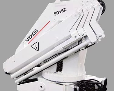 16 ton knuckle boom crane operating, lifting heavy objects with hydraulic power.