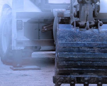 "Excavator construction equipment on concrete worksite with heavy machinery"