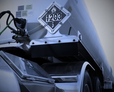 "DOT hazmat truck with 1203 gasoline placard for flammable liquid transportation"