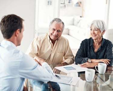 Senior couple meeting with an estate planning advisor to secure their legacy with Guarded Legacy.