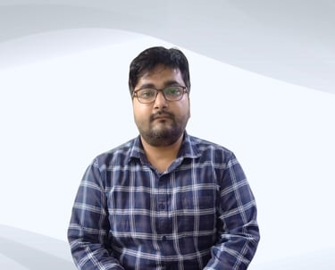 "Expert male tutor from Excellence Home Tuition standing confidently, ready to teach."