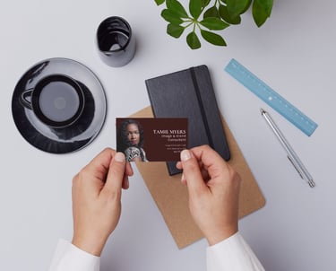 a person holding a business card with a business card