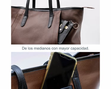 a woman's purse with a phone in her hand