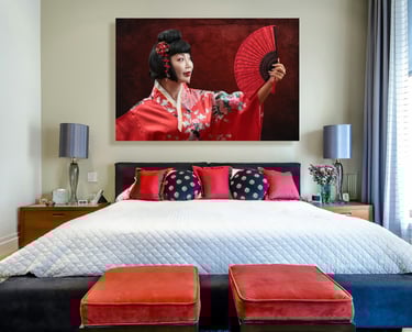 a bedroom with a large painting of a woman in a kimono