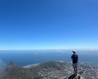The top of Table Mountain with a view of Lions Head, Robben Island and Cape Town 