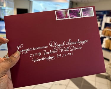 Custom calligraphy on burgundy envelope