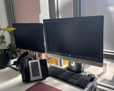 a desk with a phone phone and a phone