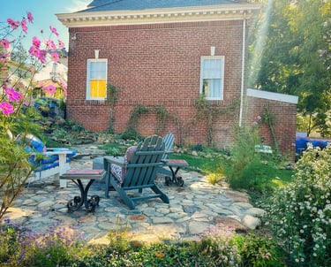 fire pit and flowers outside carriage house with love sign 2123 rivermont