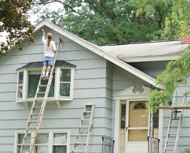 Exterior painters painting a home in Carrollton, TX