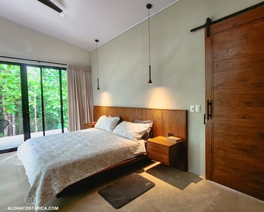 a bedroom with a bed and sliding glass doors