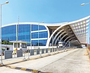 a large building with a long walkway at goa airport goi