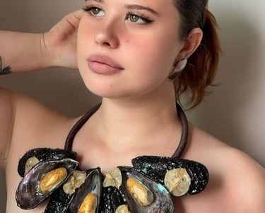 a woman with a necklace and a necklace