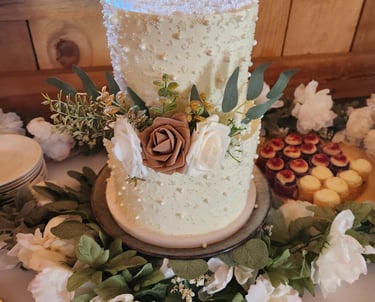 a cake with flowers and a cake on a table