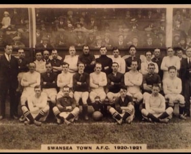Vintage black and white team photo of Swansea Town A.F.C. football players from the 1920-1921 season.