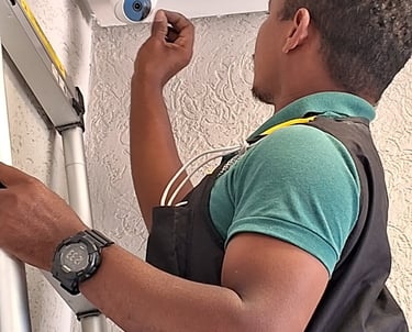 a man in a backpack is holding a camera and looking at a camera