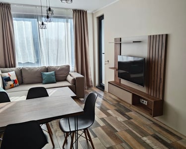 A photo of living room with tv furniture mounted on wall