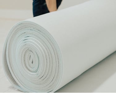 a carpet being rolled out for new room in Sugar Land TX