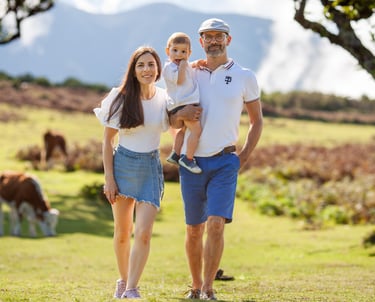 Family walking together through misty ancient forest during afternoon photography session at Fanal