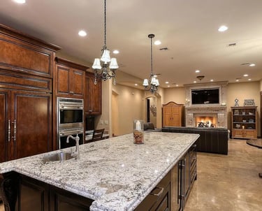 Custom kitchen remodel with oversized island and pendant lighting