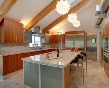 Custom kitchen remodel with oversized island and pendant lighting