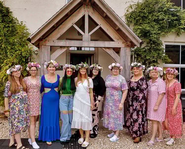 a group of hens showing off their flower crowns