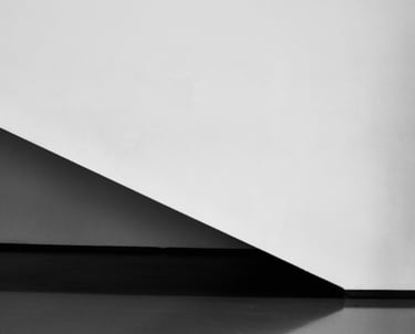 A staircase and wall captured in black and white colors