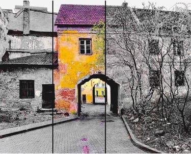 A vibrant painting of a yellow and pink building with a gate