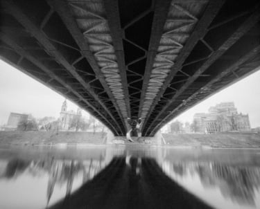 River crossing with black and white bridge