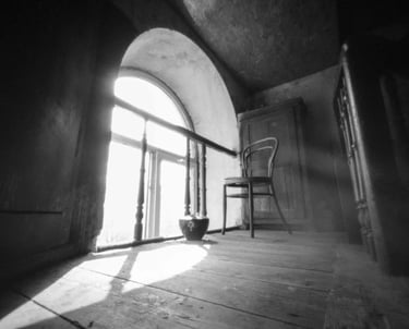 Sunlight-filled space with chair and window