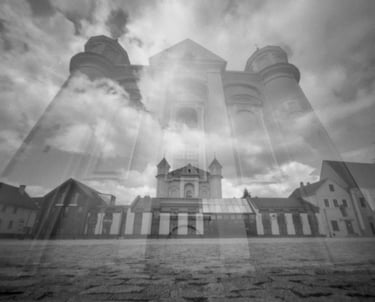 Double exposure of a black and white church against a sky backdrop